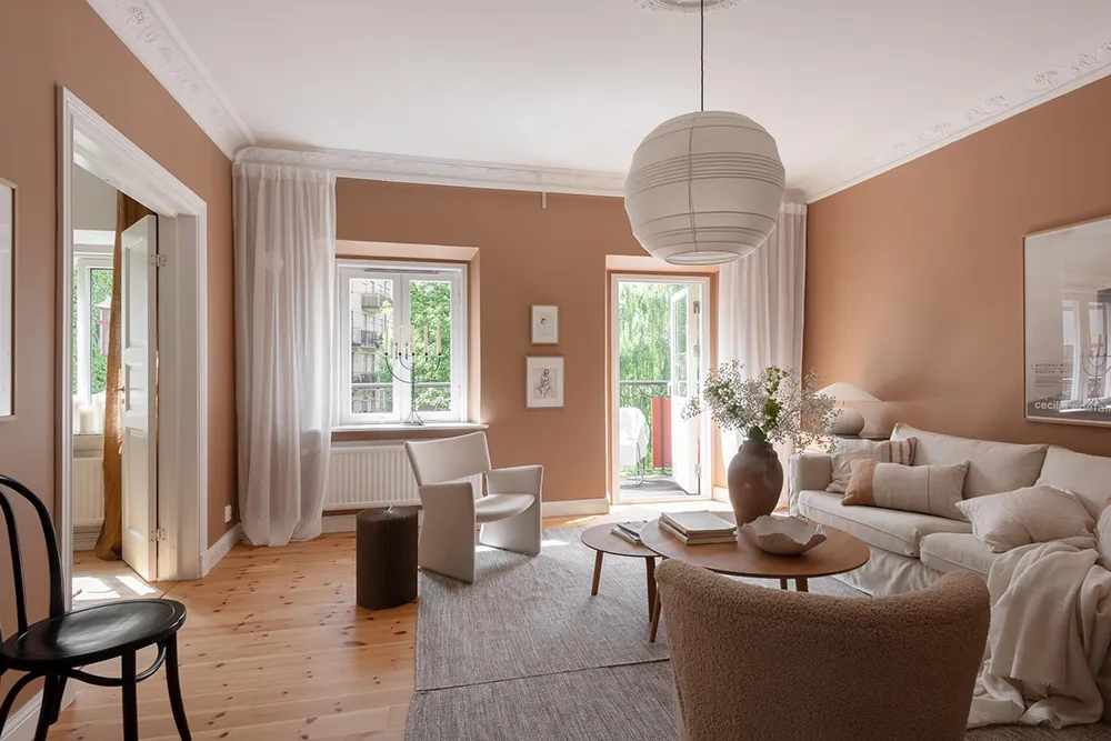 Salle de séjour en terre cuite et cuisine fraîche : appartement à Göteborg - Gallery image 3