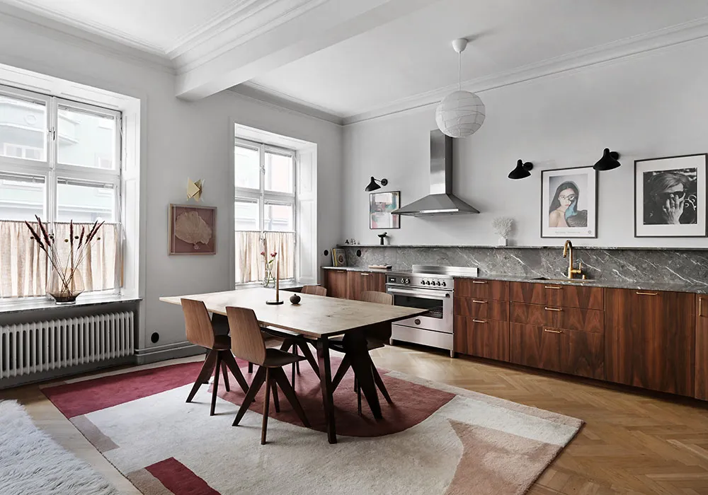 Kitchen without upper cabinets and fireplace: bright first-floor apartment in Stockholm - Gallery image 4