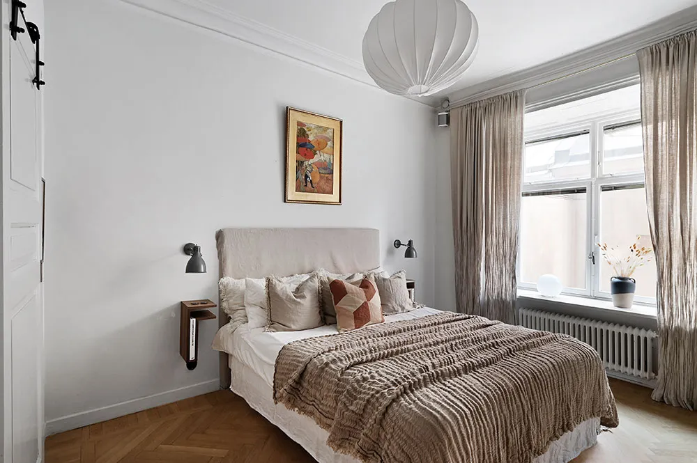 Kitchen without upper cabinets and fireplace: bright first-floor apartment in Stockholm - Gallery image 8