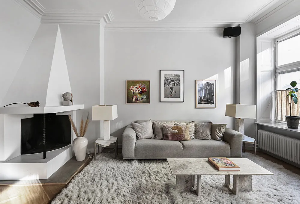 Kitchen without upper cabinets and fireplace: bright first-floor apartment in Stockholm - Gallery image 6