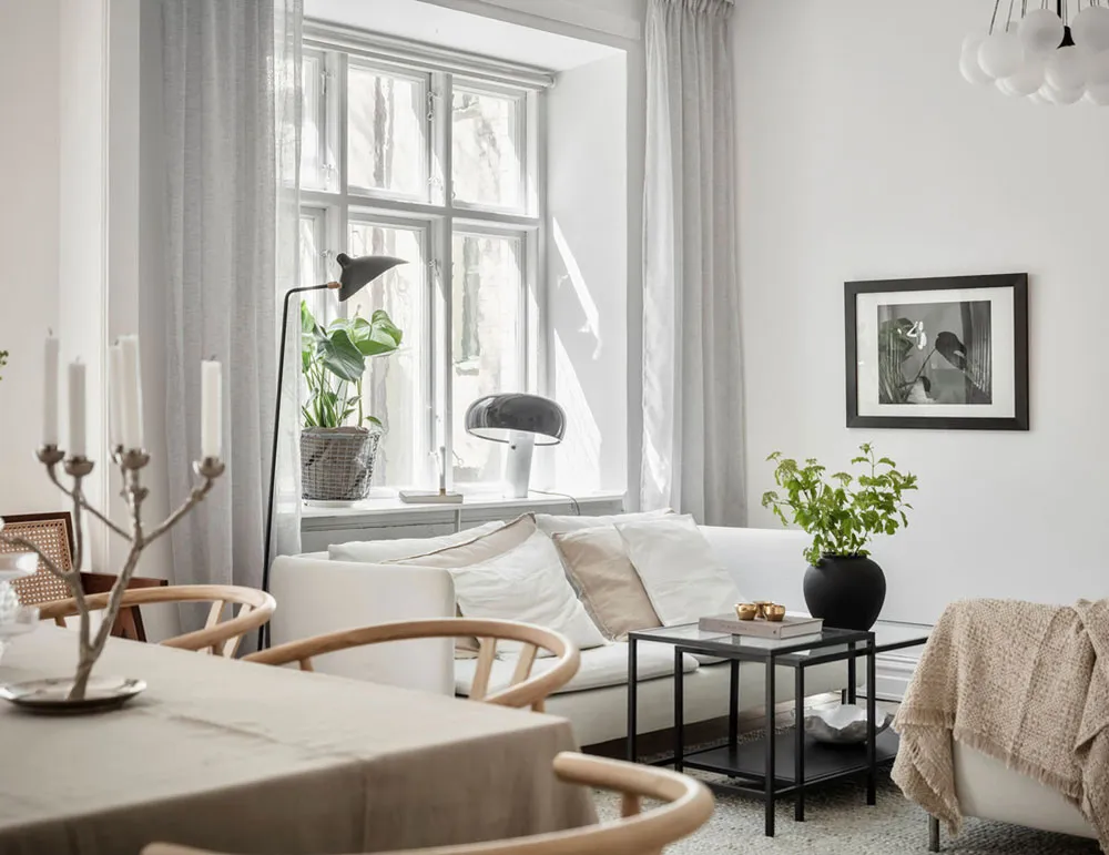 Светлый скандинавский интерьер со старинной кирпичной стеной на кухне (87 кв. м) - Gallery image 11