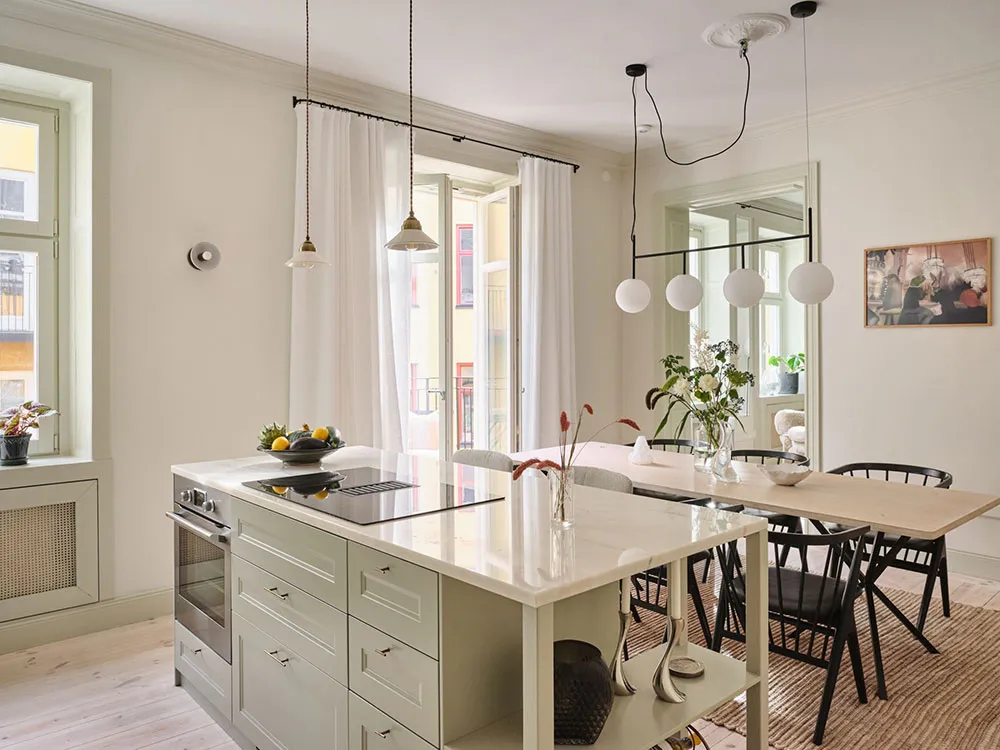 Légères touches pastel et mansarde : appartement à deux niveaux en Suède - Gallery image 2