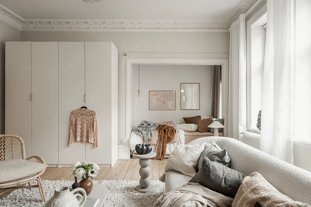 Miękki i ciepły skandynawski интерьер małej mieszkania 51 m² - Gallery image 11