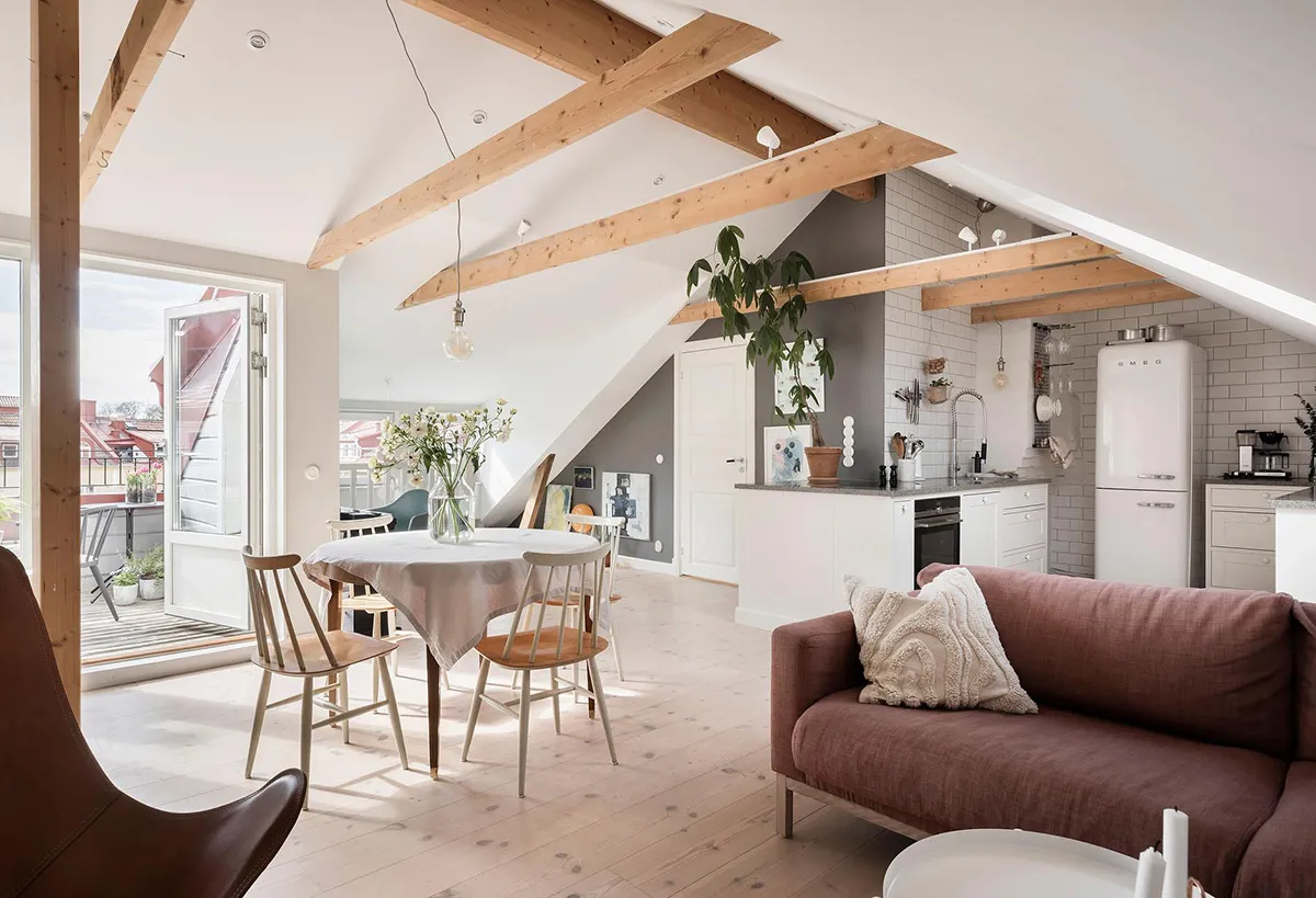 Bright and cozy attic apartment in Sweden with pastel accents in decor