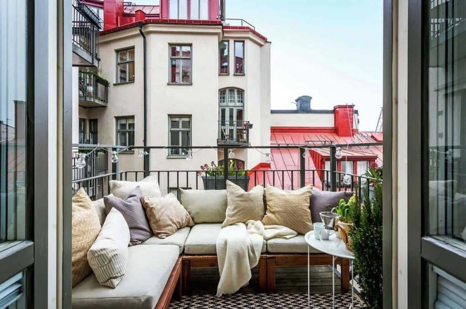 How to Make the Space of an Open Balcony More Private? A sofa or sofa, turned away from the street, will help. Hang planters with plants on the railings.