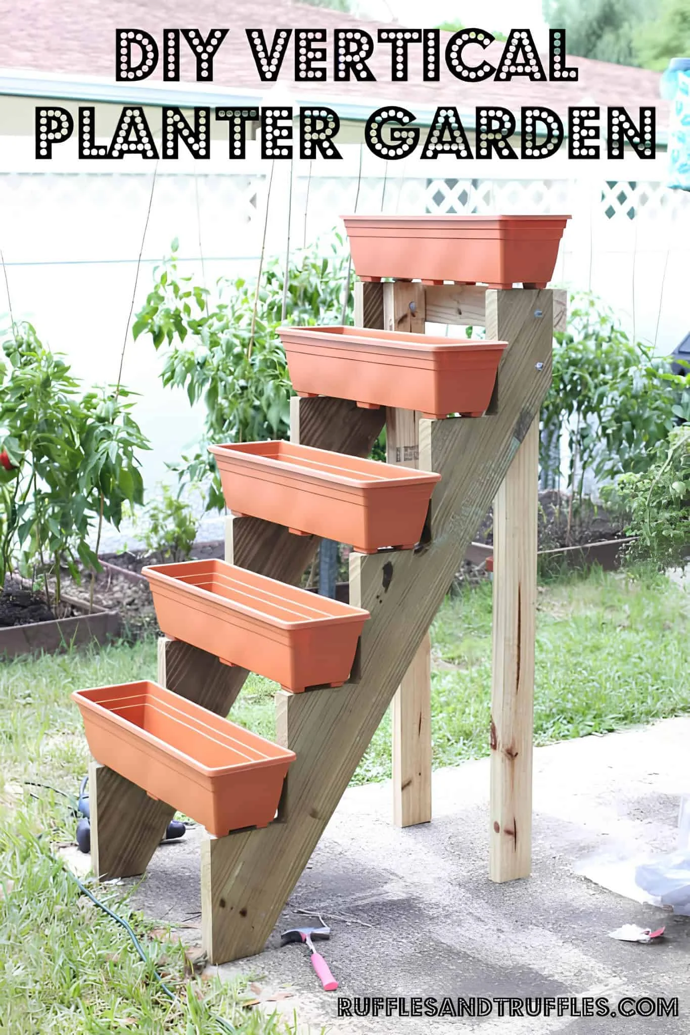 Wooden staircase planter stand with orange flower boxes