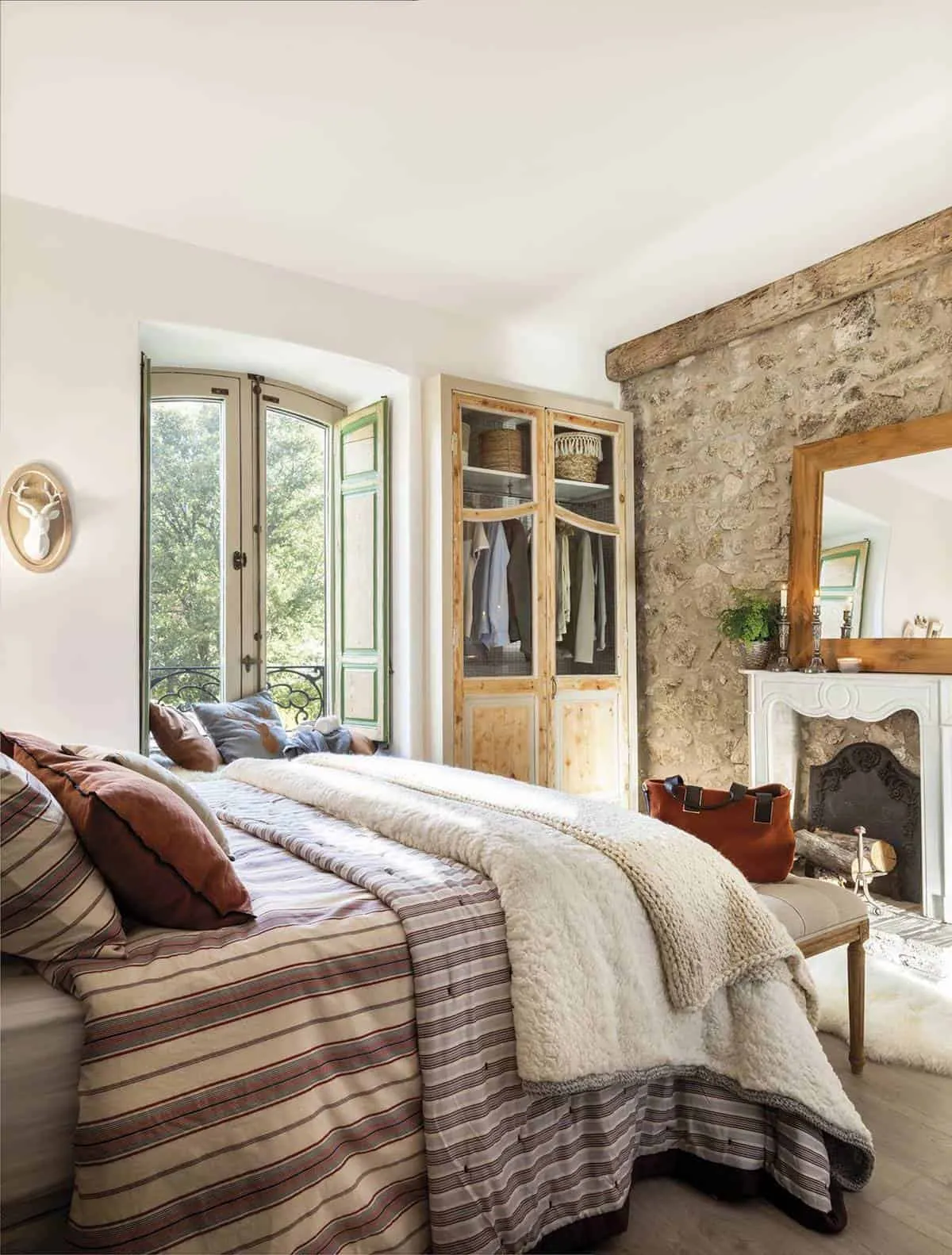 4. Cozy Bedroom with Decorative Fireplace