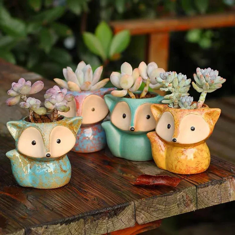 12. Planter con zorros