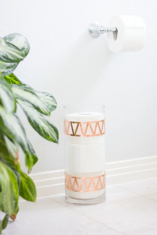 9. DIY Toilet Paper Storage Using a Glass Vase