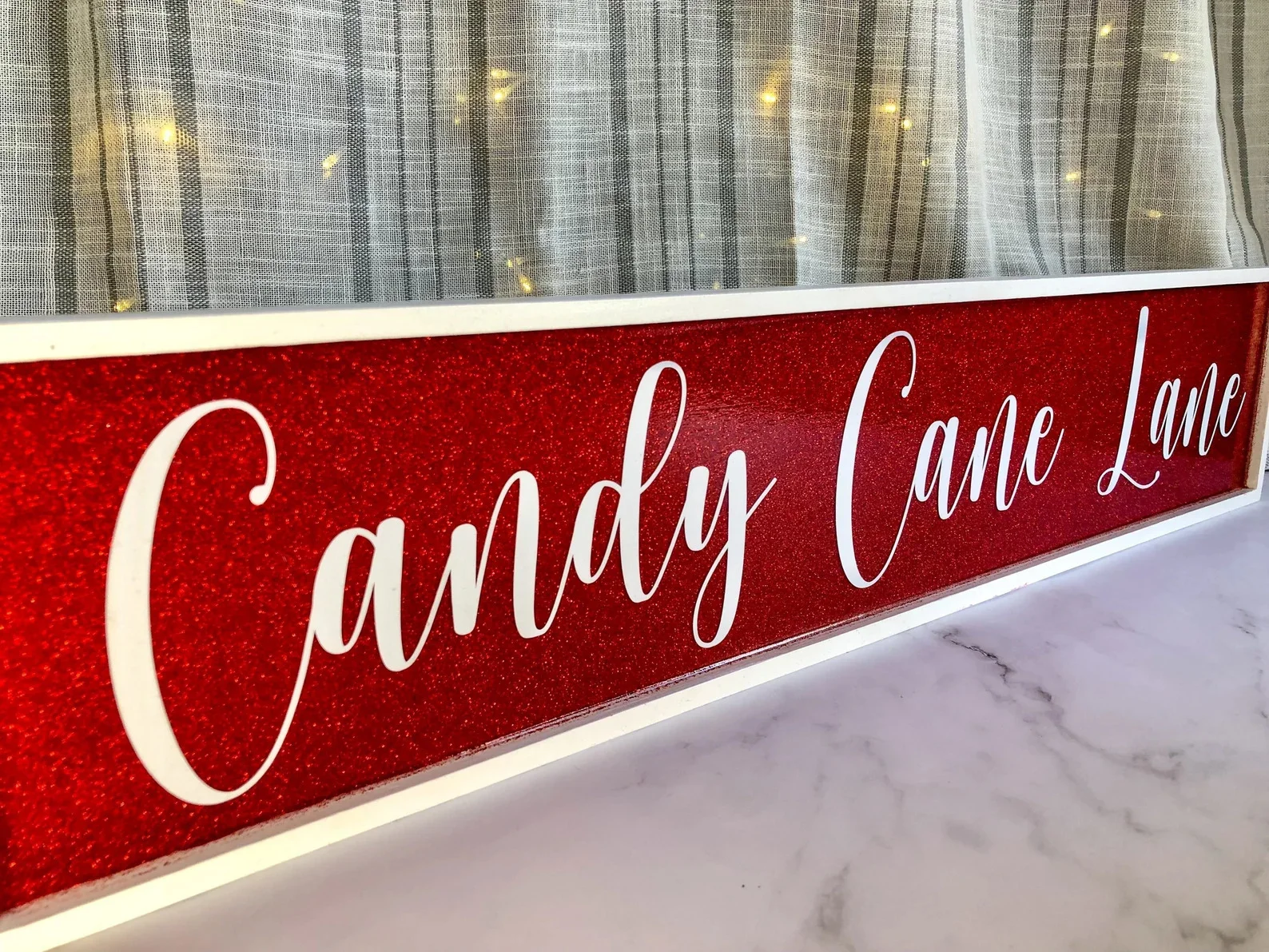 15. Candy Cane Lane Christmas Glitter Sign