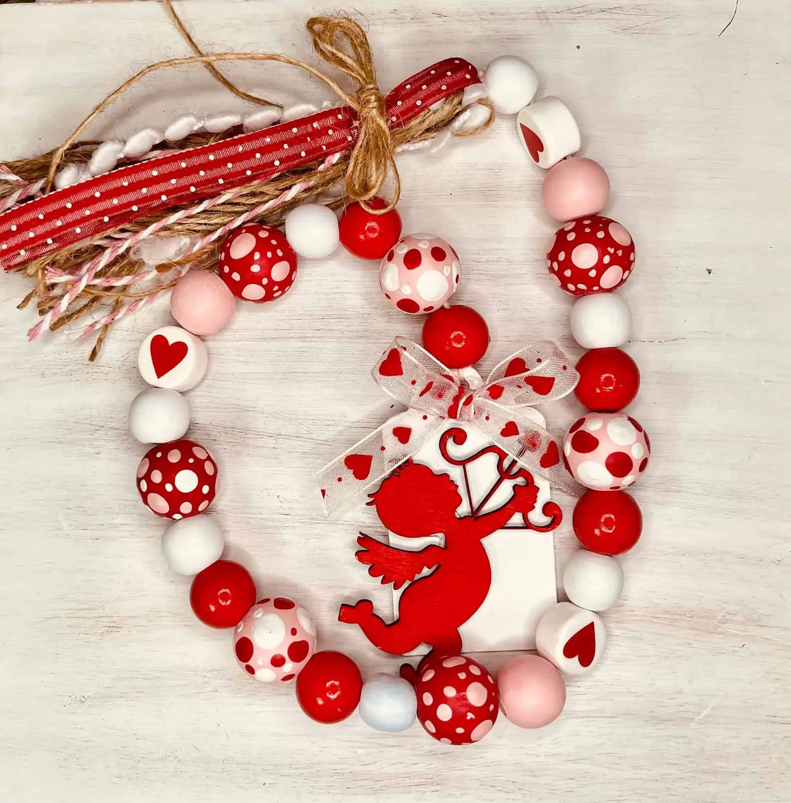 7. Farmhouse Style Valentine's Day Wooden Garland with Cupid