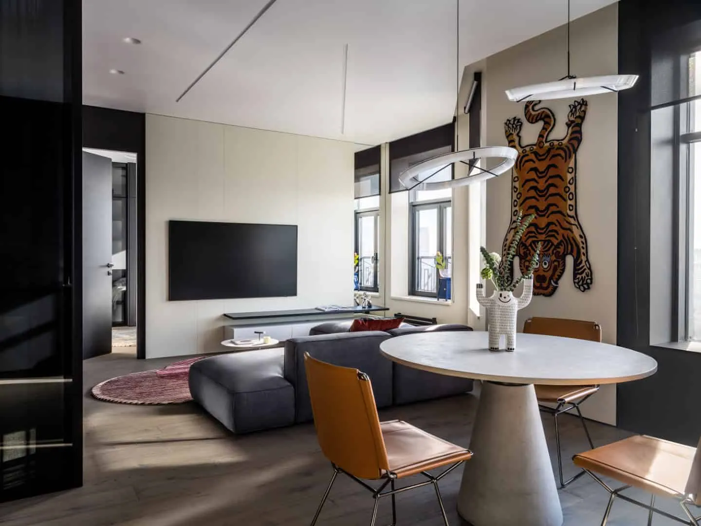 Open space with bright accents and a glass office nearby