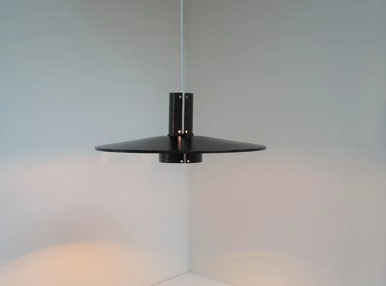 15. Lámpara Flipper con acabado en bronce