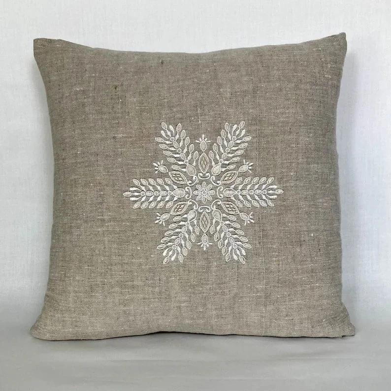 8. Rustic Linen Pillow with Embroidered Snowflake