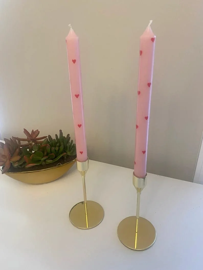 4. Velas tipo tapa rosadas