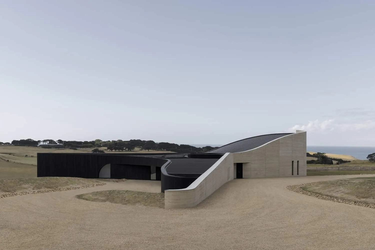 Light well on ridge illuminating the wall of compressed earth with daylight