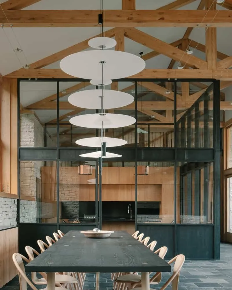 Detail of wooden joints and ceiling connecting to stone wall, showing precise craftsmanship.