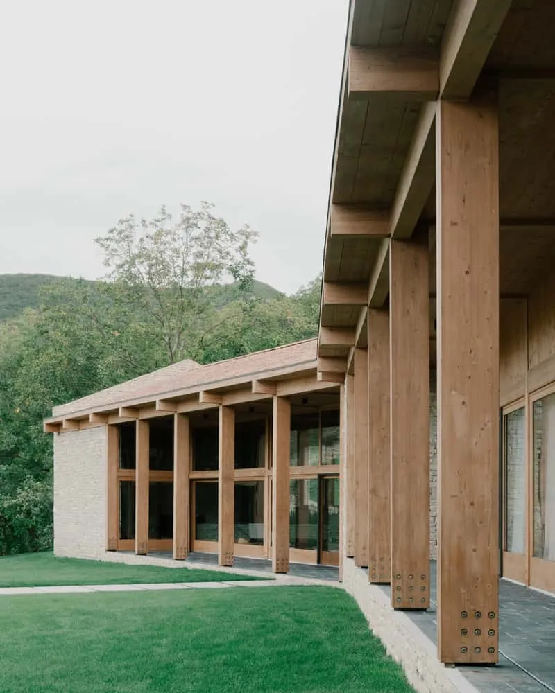 Interior composition of stone, wood and glass with softly modulated daylight.