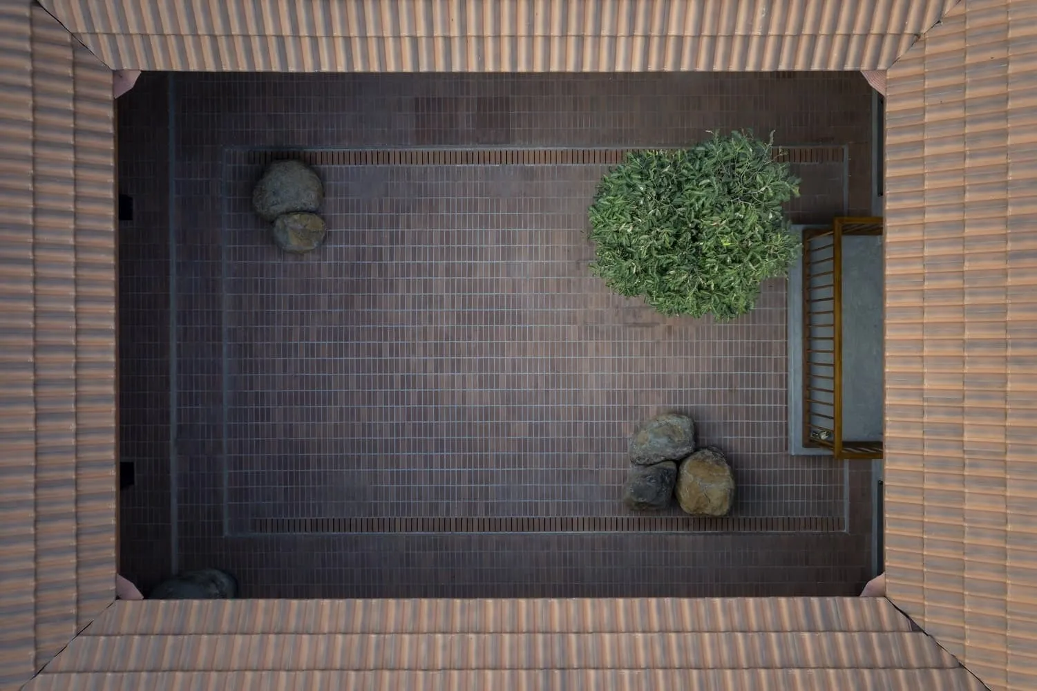 Gabled roof against evening sky, framed by deep overhangs.
