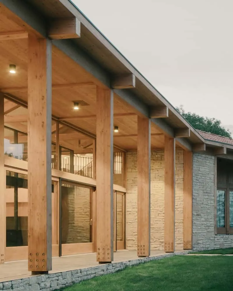 Stone and wooden basement part, perpendicular to the main house, forming a cozy courtyard.