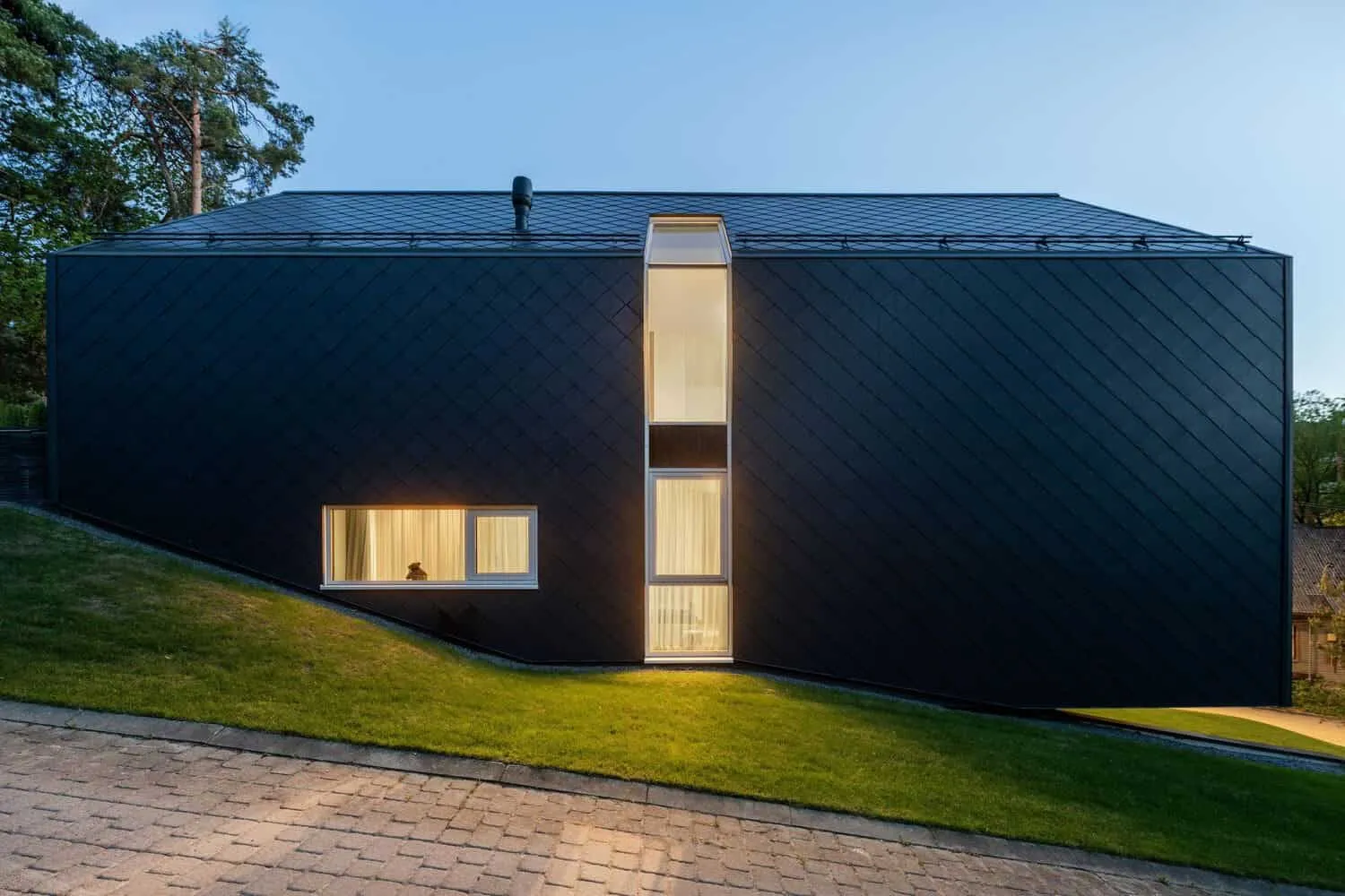 Two-Story House by ArchLAB Studio: Cozy Retreat Amidst Pine Forests in Vilnius