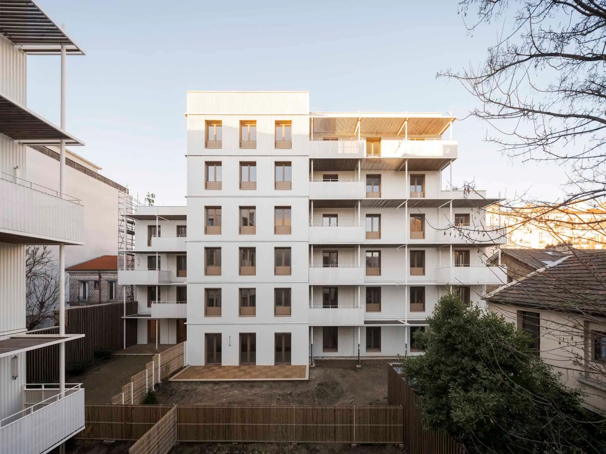 View of the residential block from central courtyard with fence