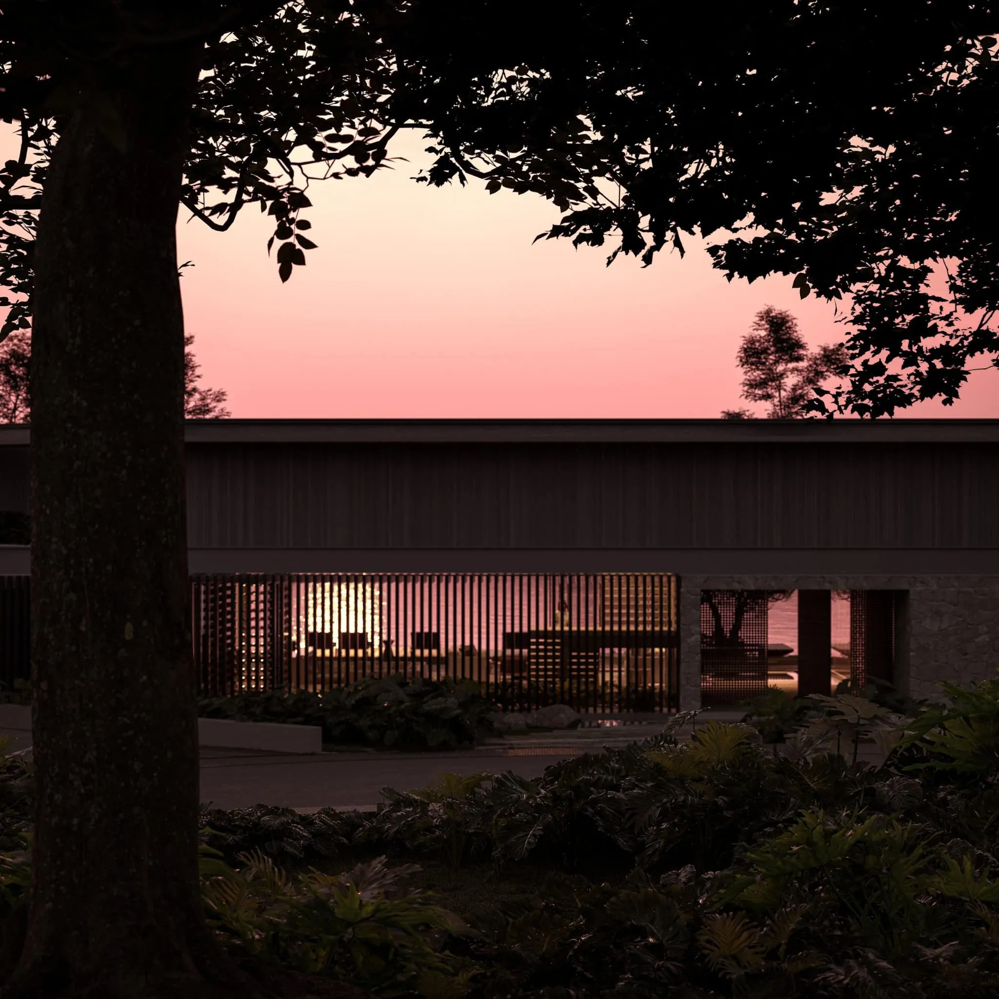Architectural silhouette of the house visible through trees at dusk.