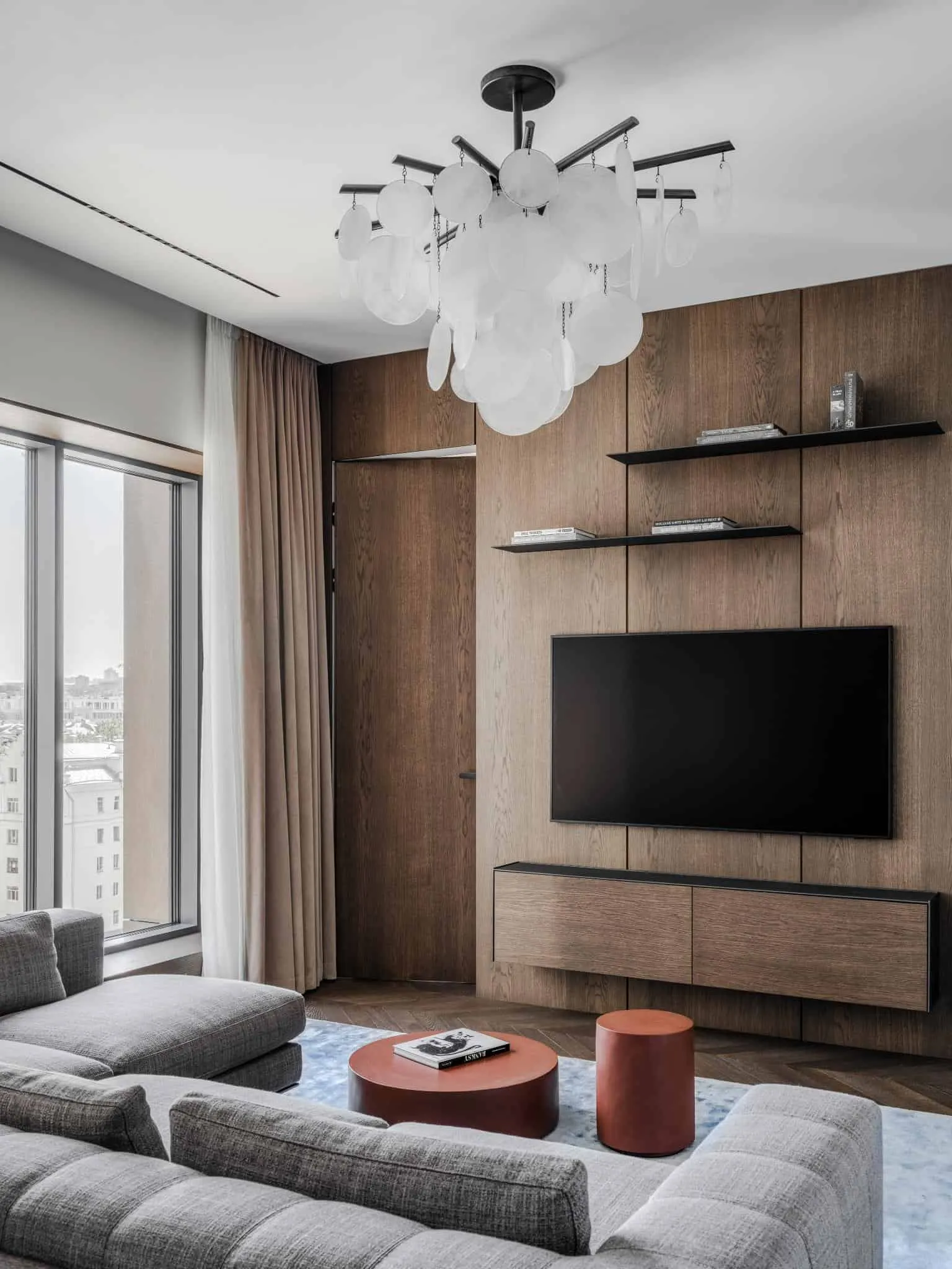 Chandelier and wooden finish in living room.