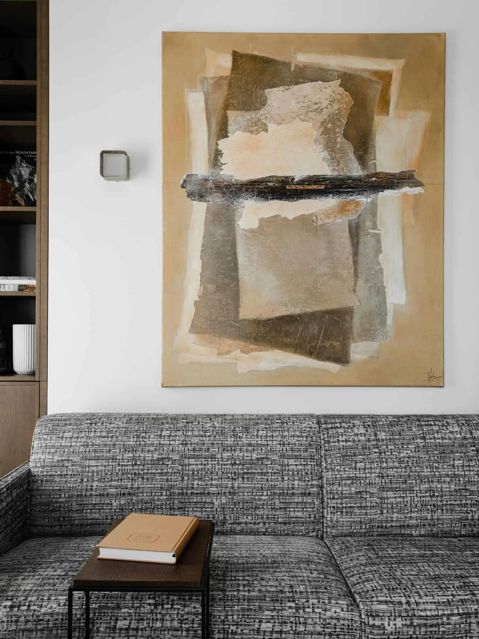 Gray sofa and textured abstract art.
