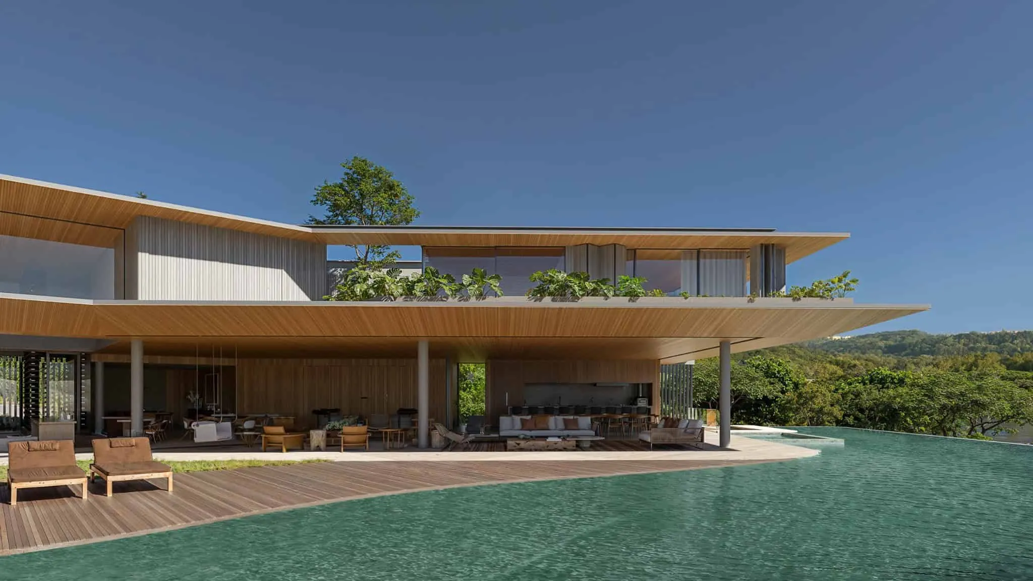 Modern villa design with wooden ceiling and infinity pool.