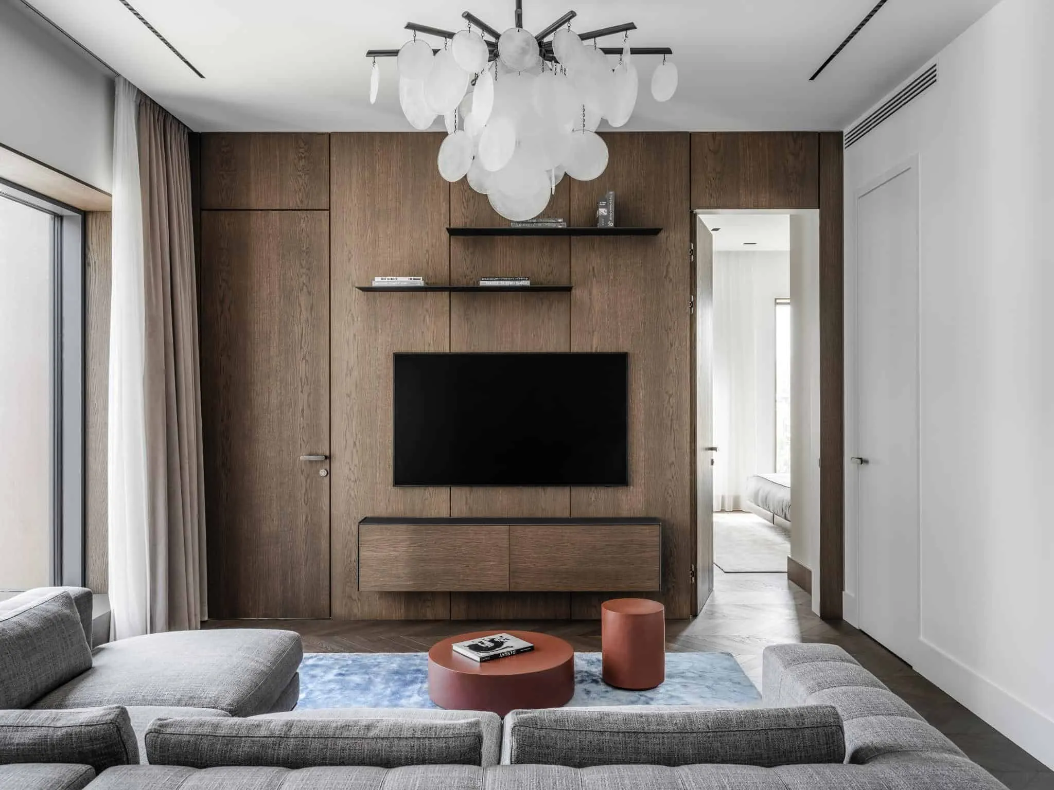 TV wall and chandelier.