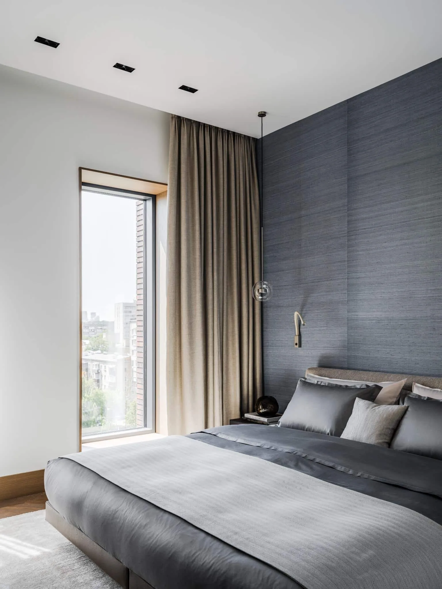 Modern bedroom with gray textured wall.