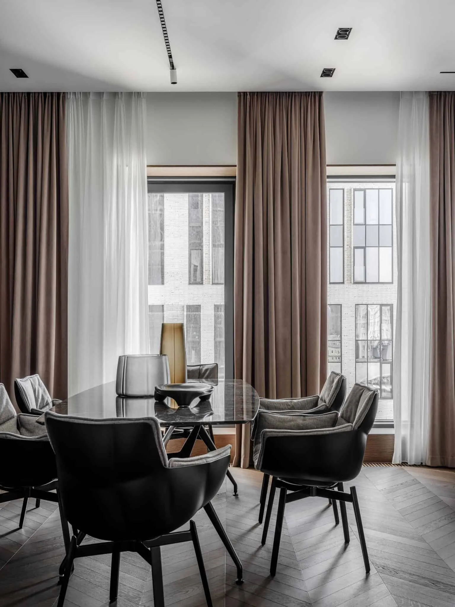 Open living-dining area with large windows.