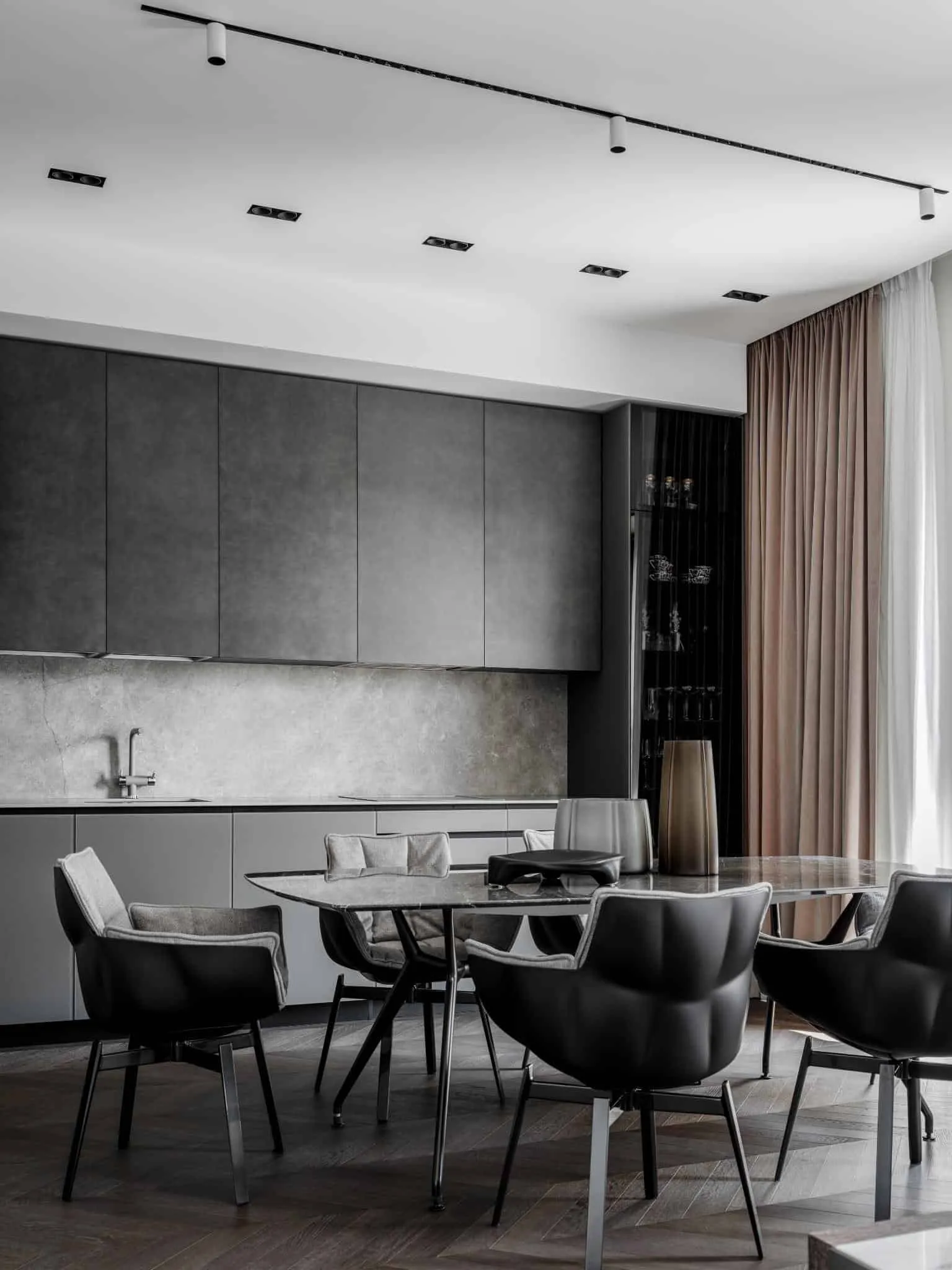 Dining area with natural light and curtains.
