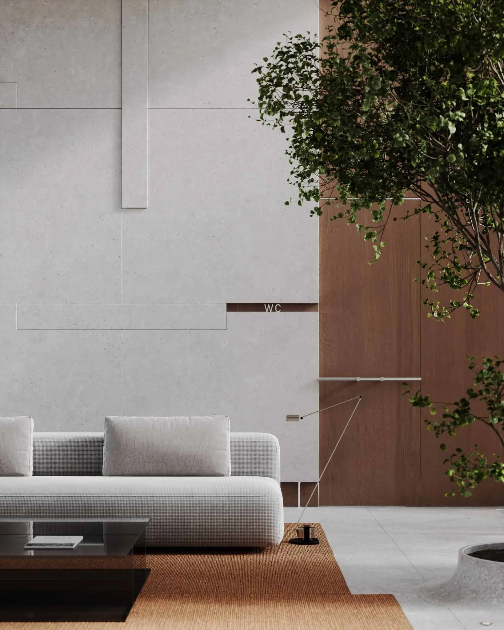 大堂角落配有柔和灰色沙发、棕色地毯和靠近混凝土墙的内嵌木饰面。