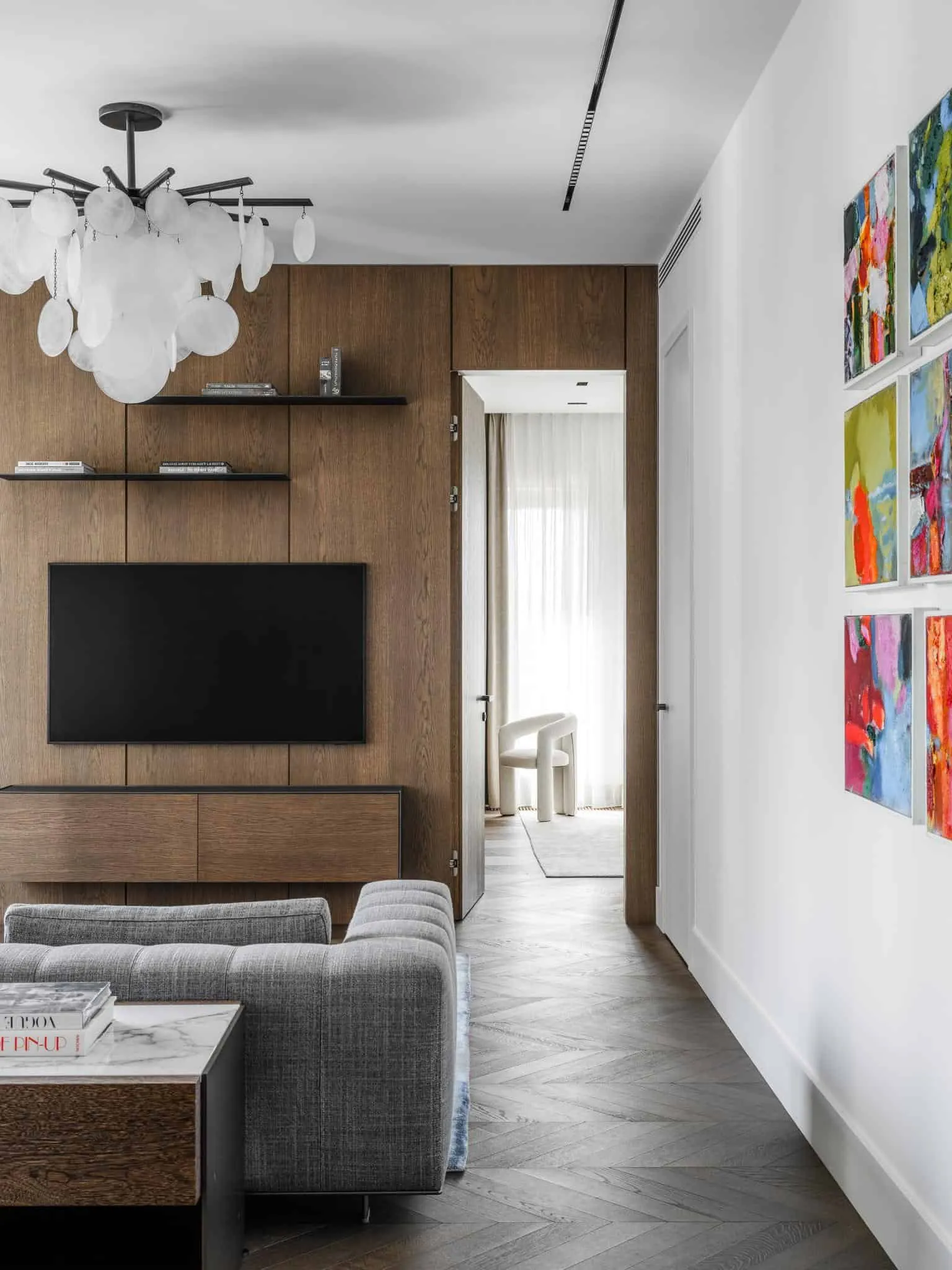 Passage with painting and entrance to bedroom.