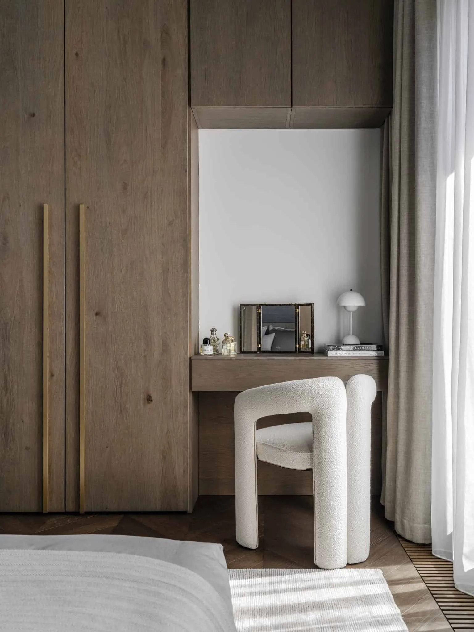 Makeup corner with textured white chair.