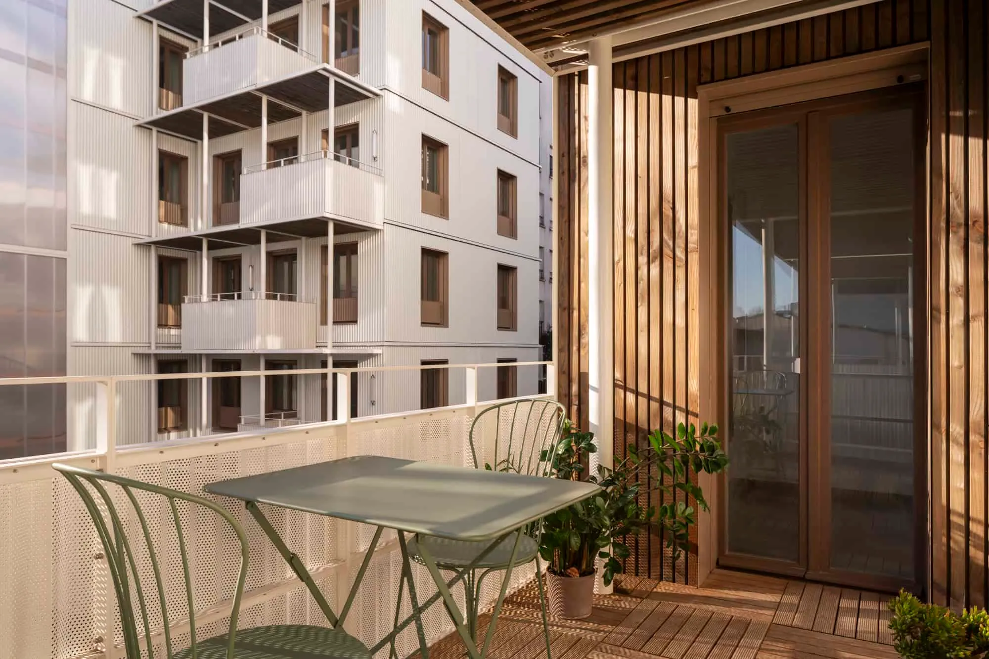 Cozy balcony view with wooden finish and white metal railings