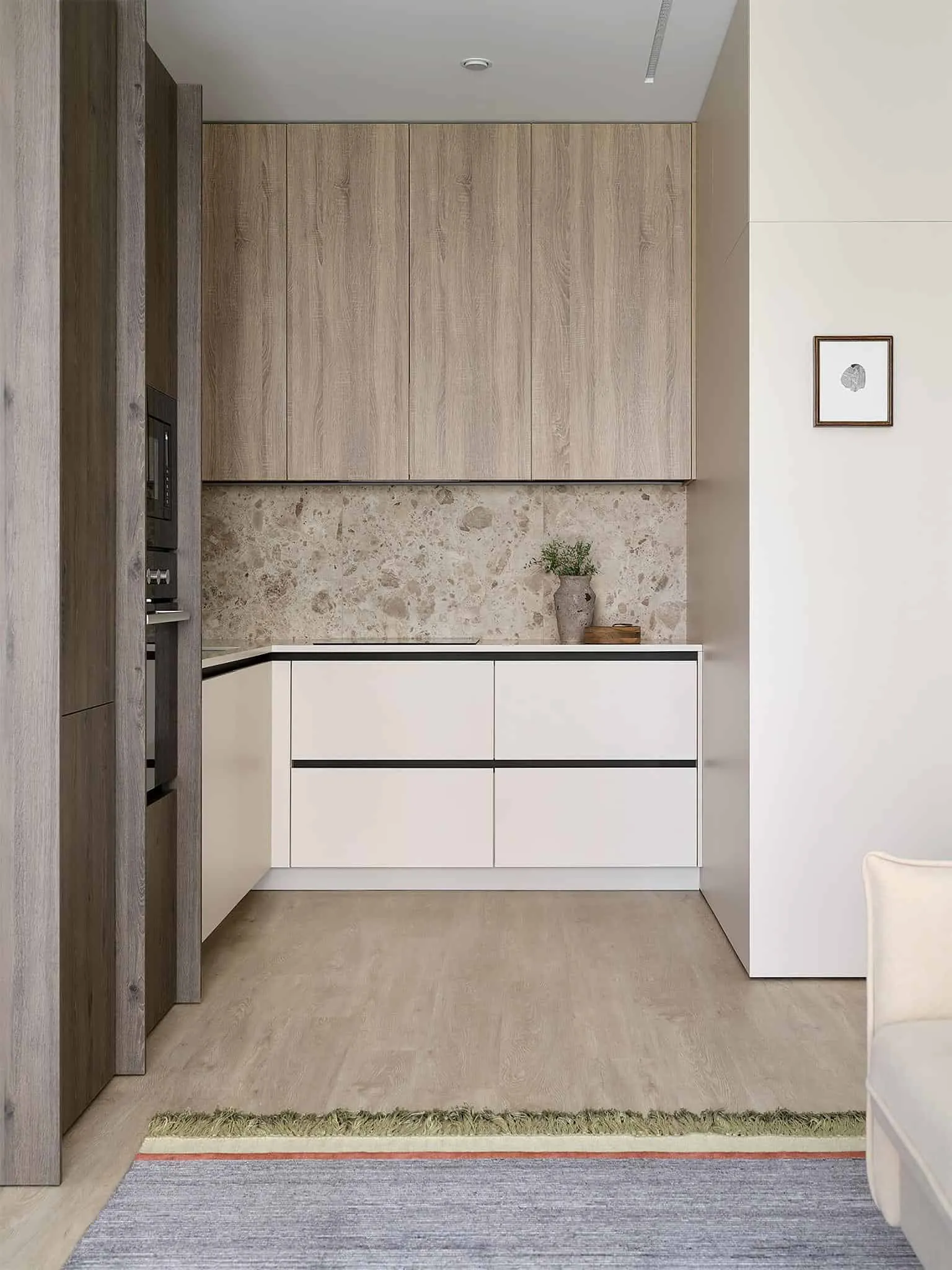 极简米色厨房配有简洁柜体和天然石材底板。