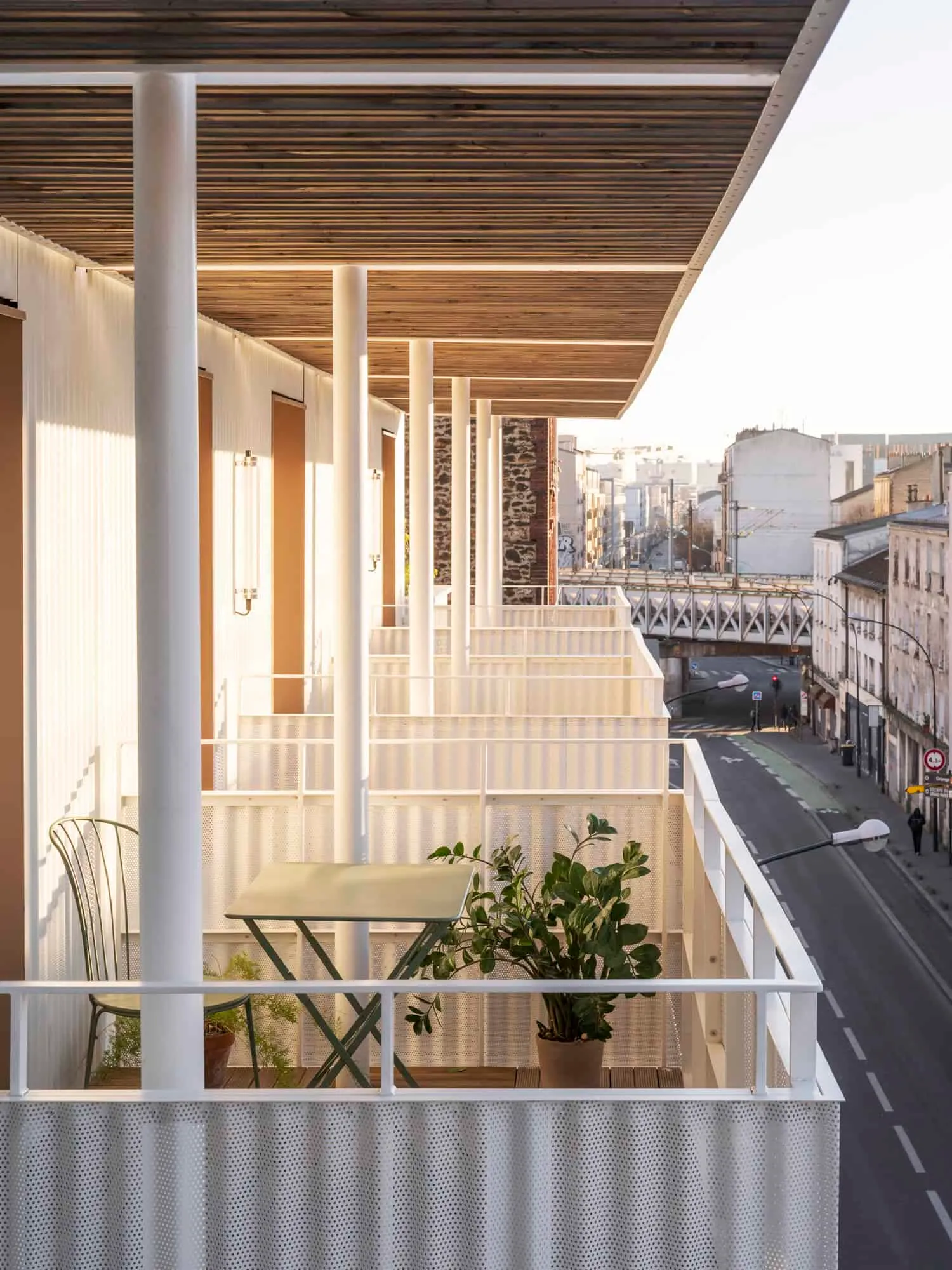 Balcony view of the Saint-Denis residential complex with furniture and planters