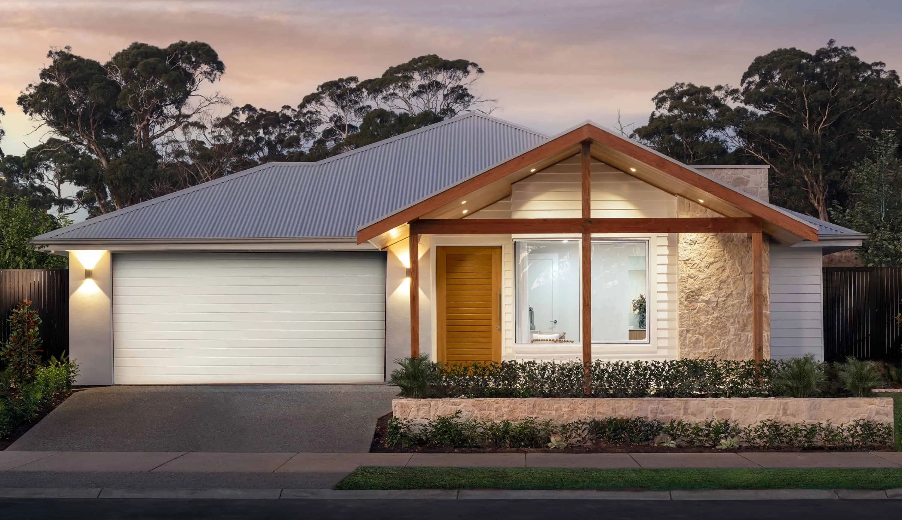 Modern house with a box gable roof, wooden entrance and stone facade wall