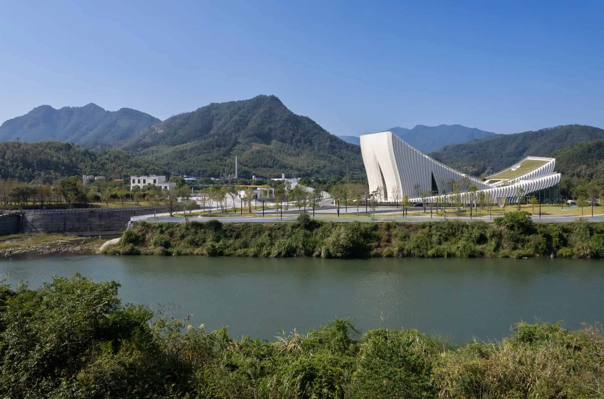 Sunner Museum exterior with mountain background Sunner Museum exterior by Atelier Alter Architects with mountain background
