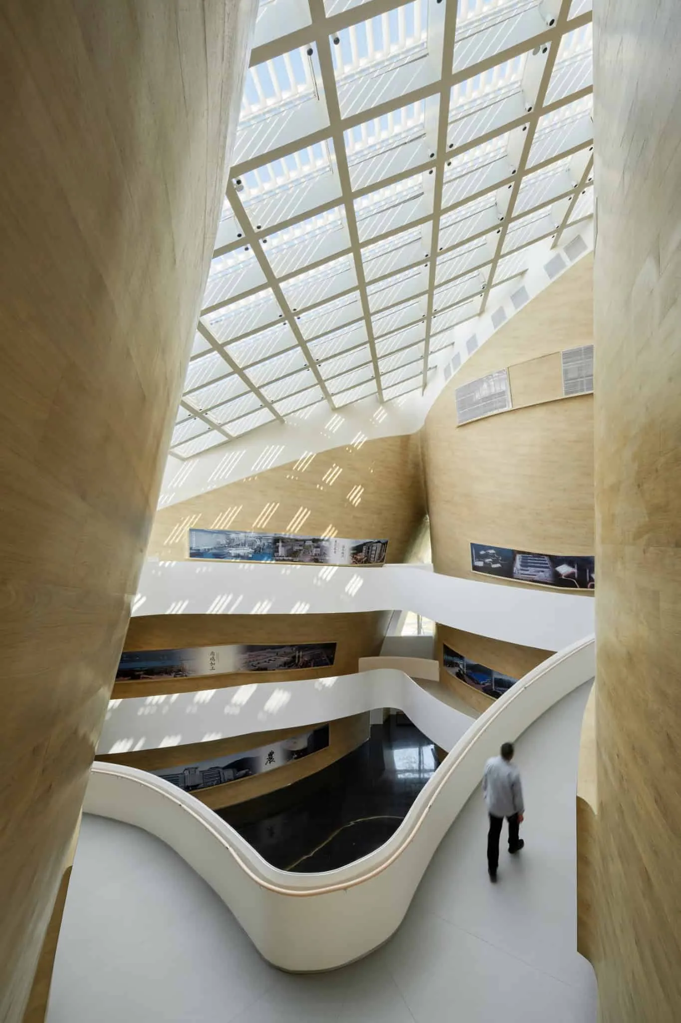 Stairs on third floor of Sunner Museum View of upper stairs in Sunner Museum, curved within the atrium with shadows from sky
