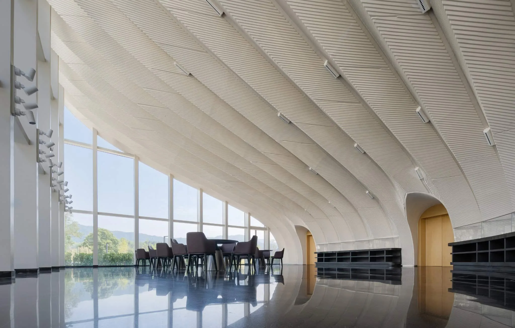 Interior hall of Sunner Museum Museum dining hall with arched, ribbed ceiling and mountain views