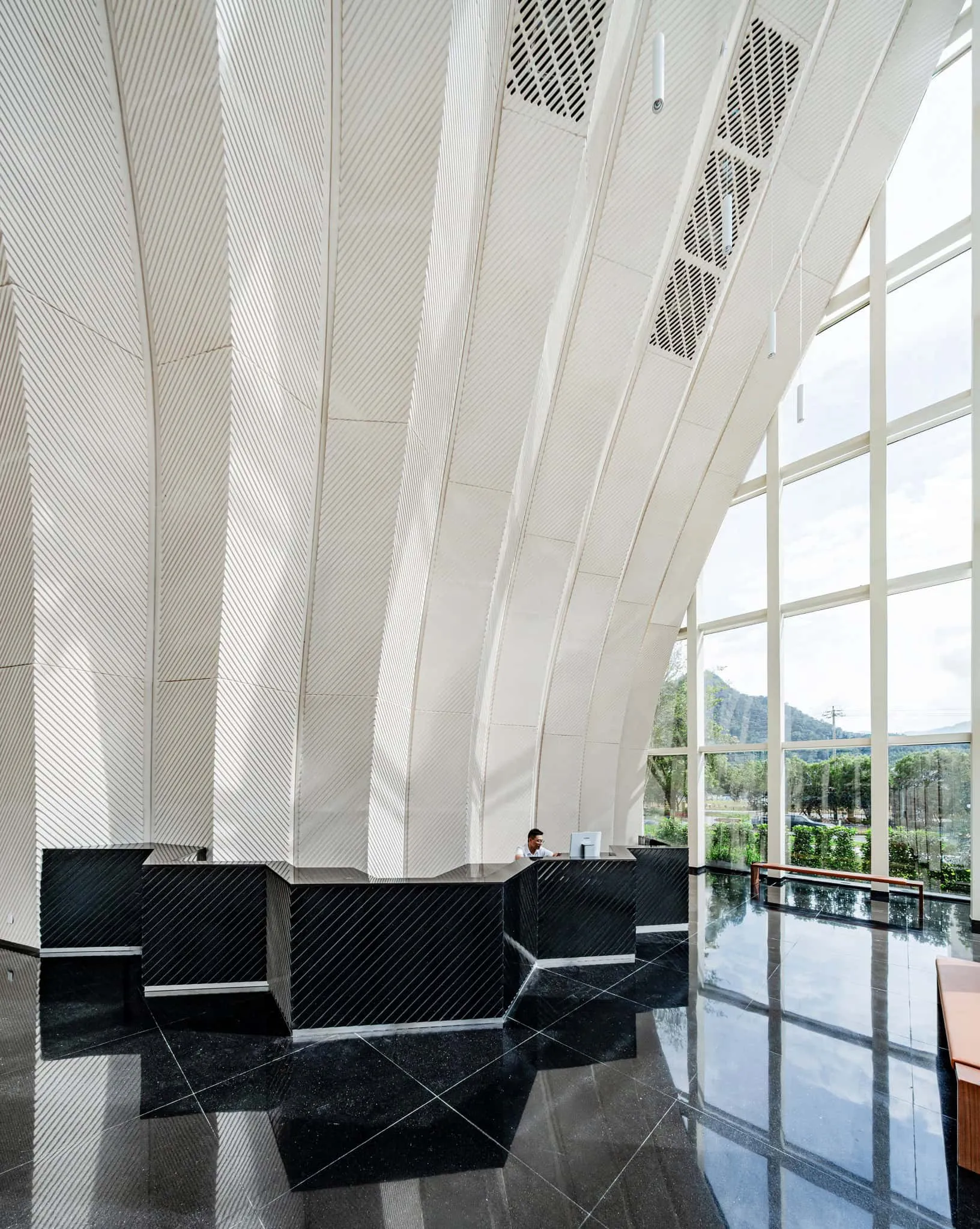 Reception area of Sunner Museum Museum reception area with minimalist black desk and high ceilings