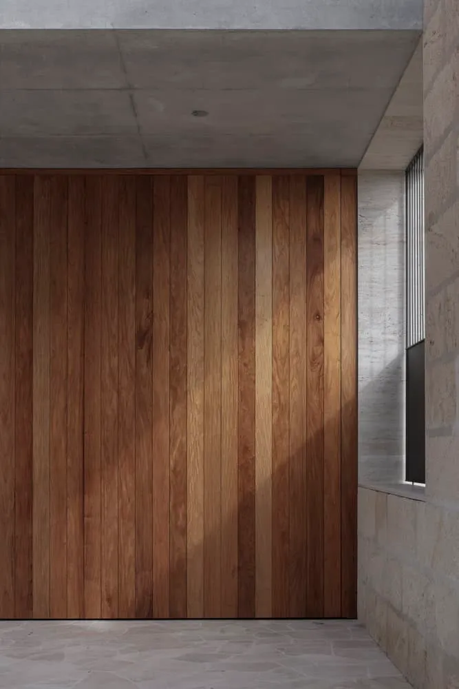 Detail of vertical wooden cladding under concrete ceiling in Newcastle