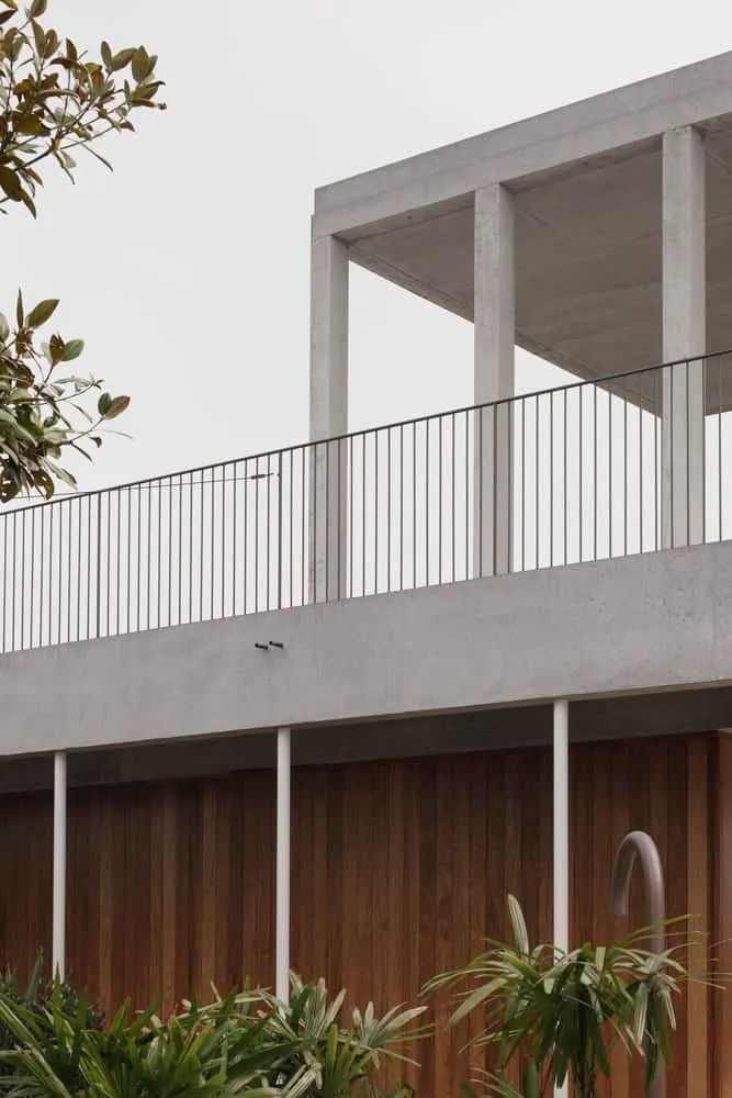 Open concrete pavilion and vertical wooden cladding in Newcastle
