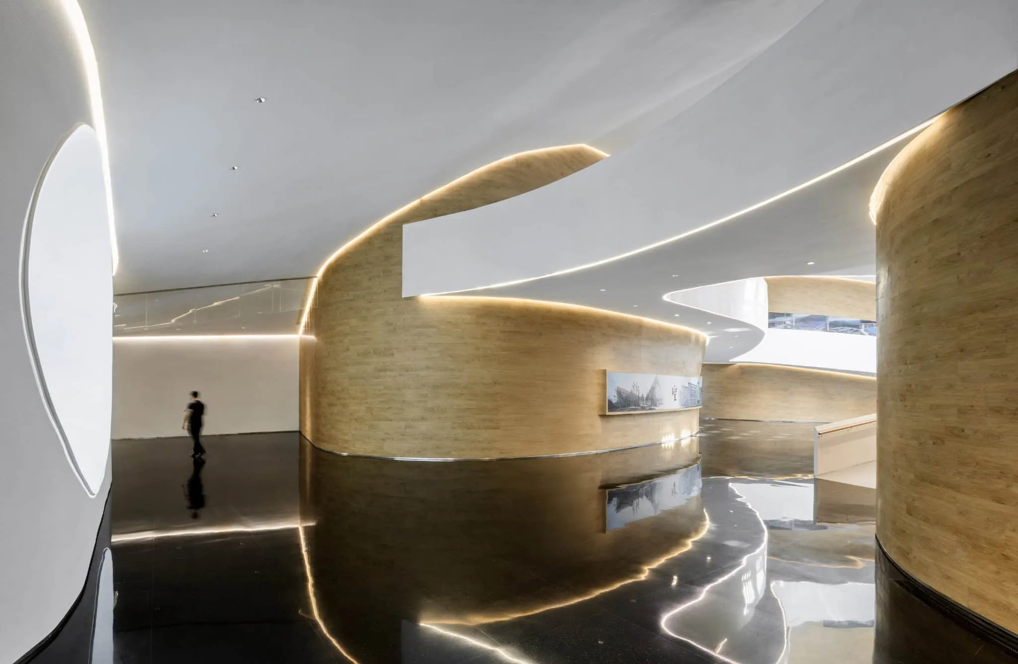 Curved corridor of Sunner Museum Curved interior corridor of Sunner Museum exhibition hall with soft lighting