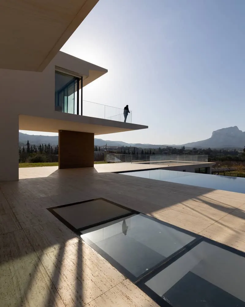 Silhouette of a figure on the protruding upper terrace at sunset