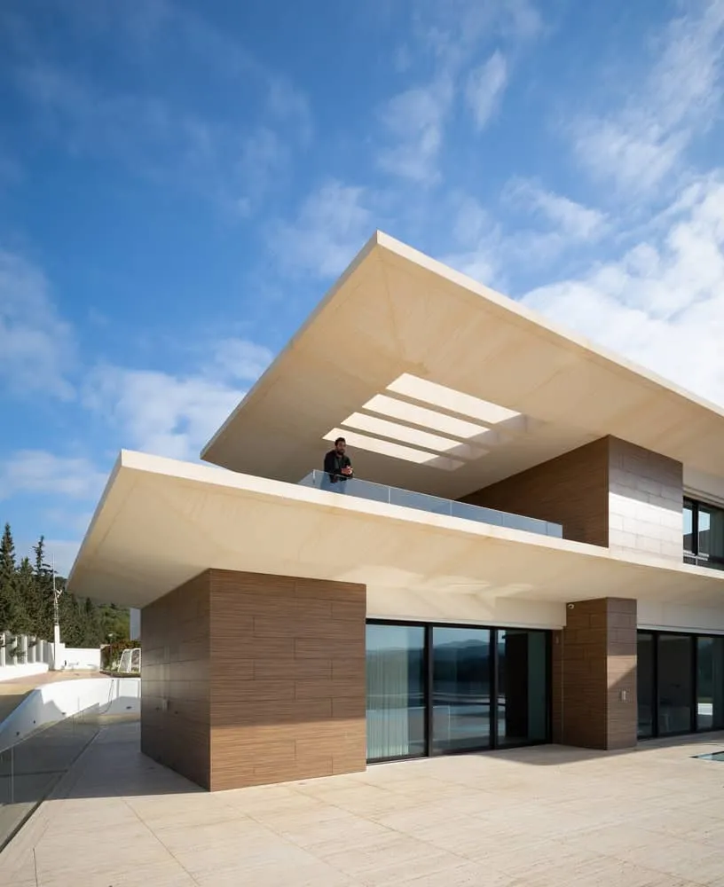 Light passing through architectural cutouts on the balcony